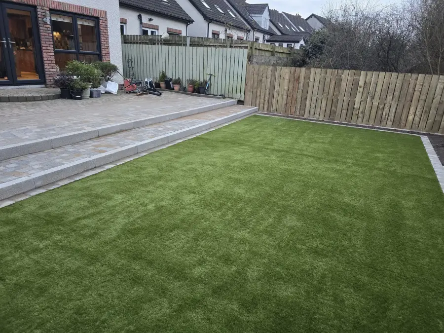 Artificial grass and paving garden by Perfect Paving Belfast