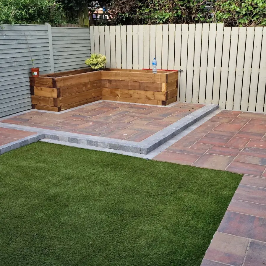 Tobermore block paving with artificial grass and raised planters by Perfect Paving Belfast
