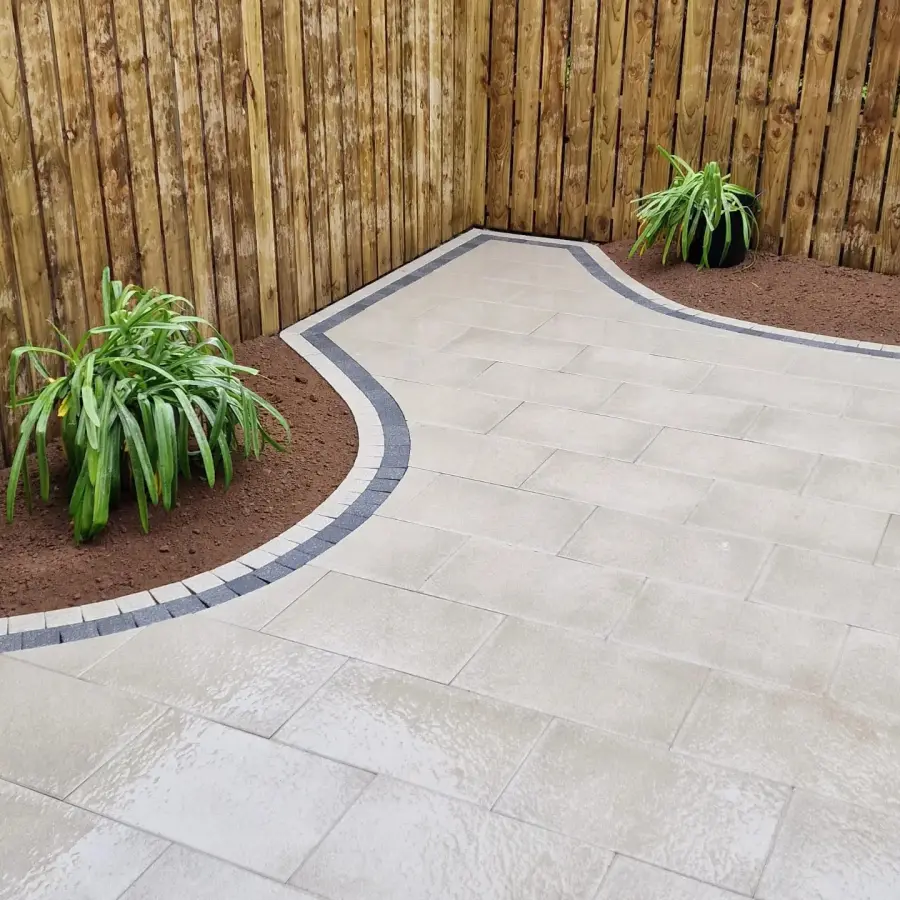 Curved porcelain path with planting by Perfect Paving Belfast